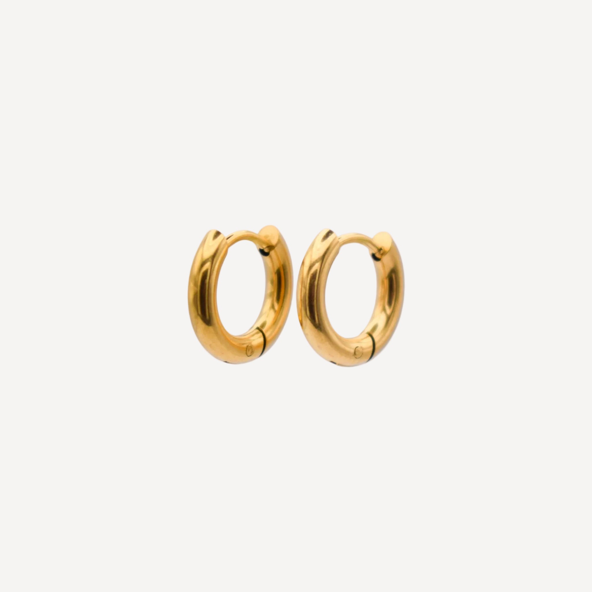 Gold hoop earrings on a white background