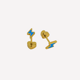 Pair of gold earrings with blue lightning bolt designs on a white background