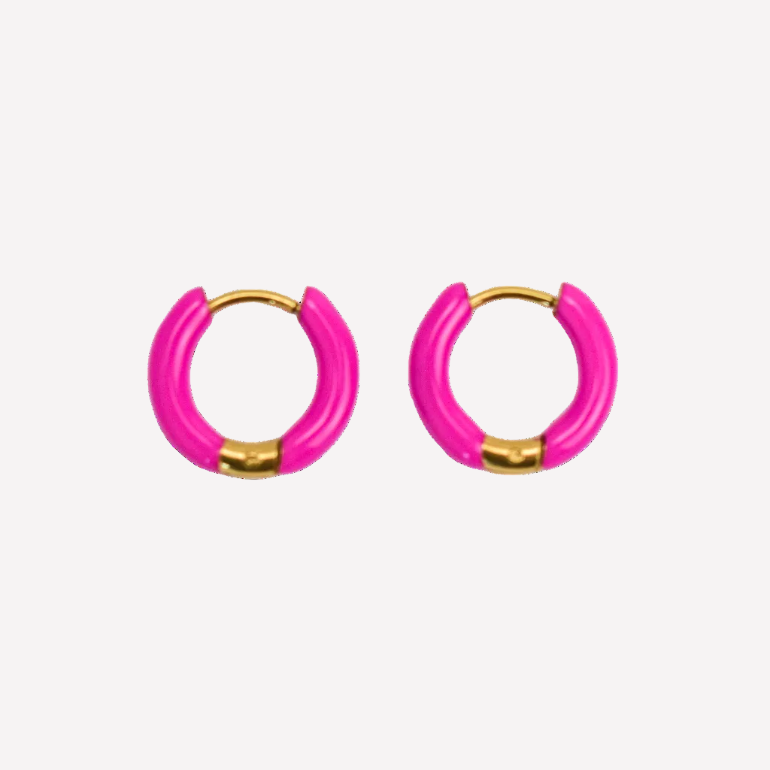 Pair of pink hoop earrings with gold accents on a white background