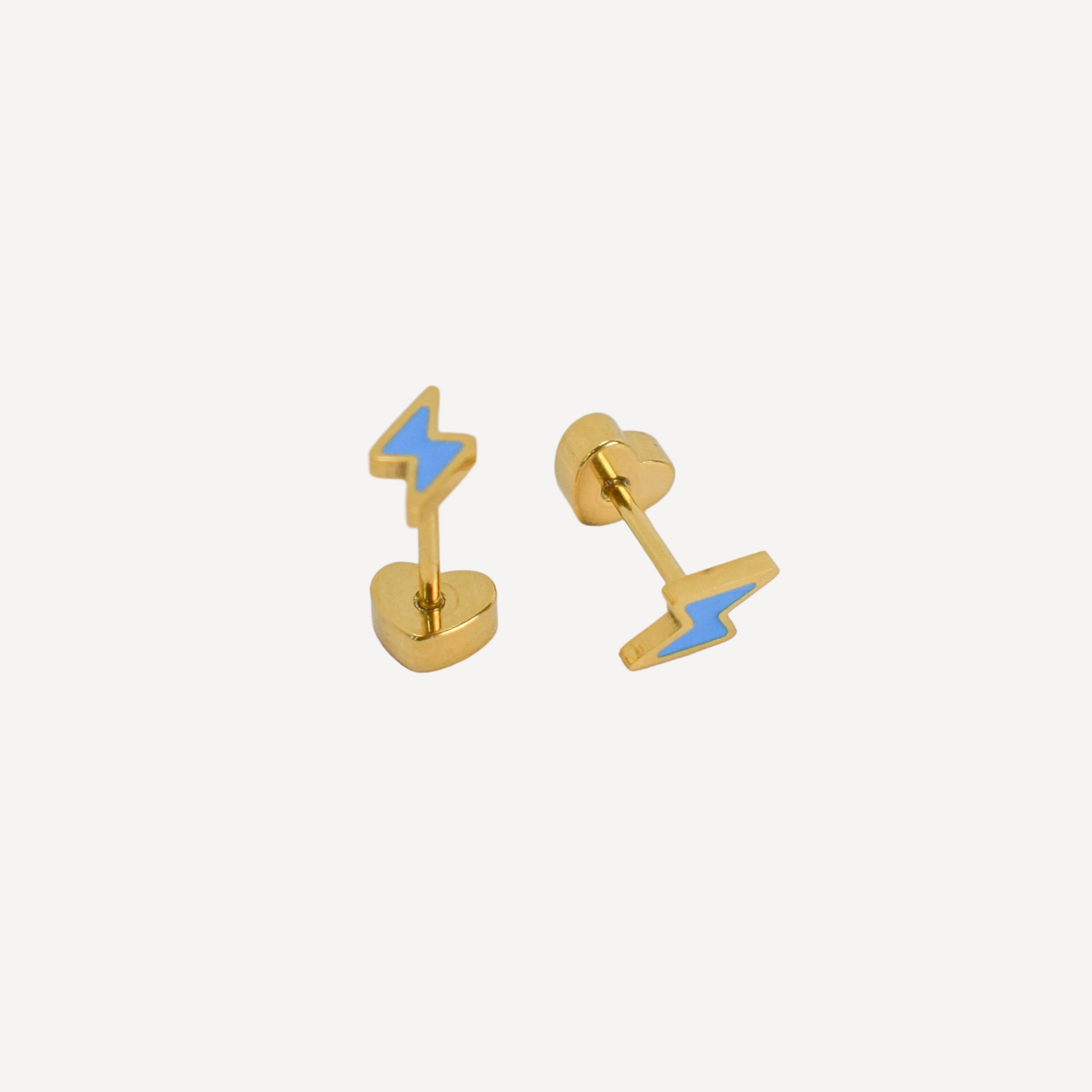 Pair of gold earrings with blue lightning bolt designs on a light gray background