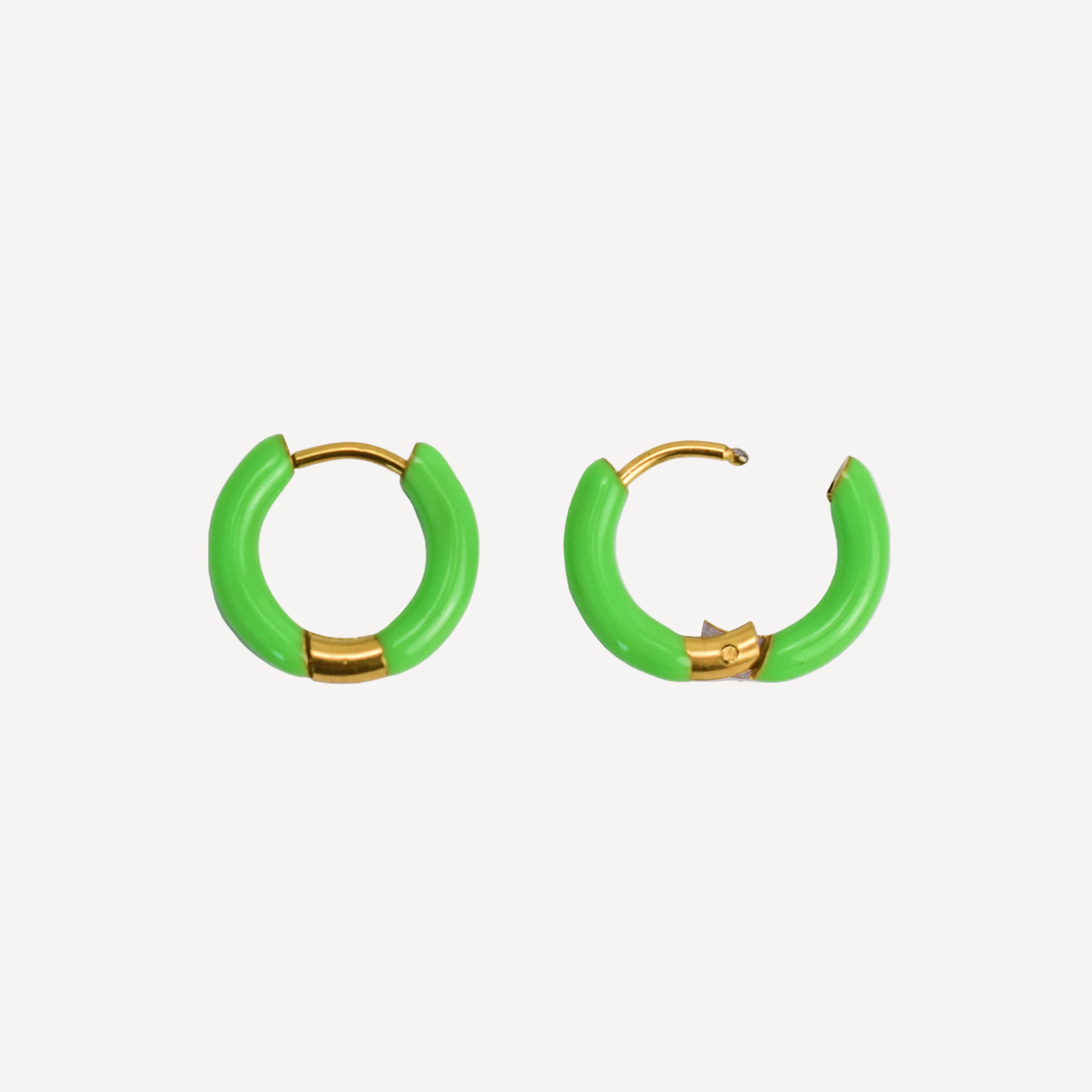 Green hoop earrings with gold accents on a white background