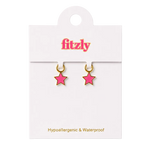 A pair of small pink star-shaped hoop earrings with gold-tone rims, displayed on a white Fitzly retail card against a white background.